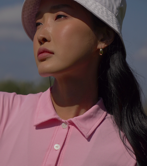 girl wearing golf dress in the sun