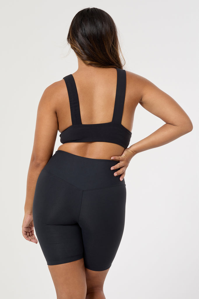 Black deep V-neck low-impact support with a seamless fit, removable padding for all-day comfort and style back view