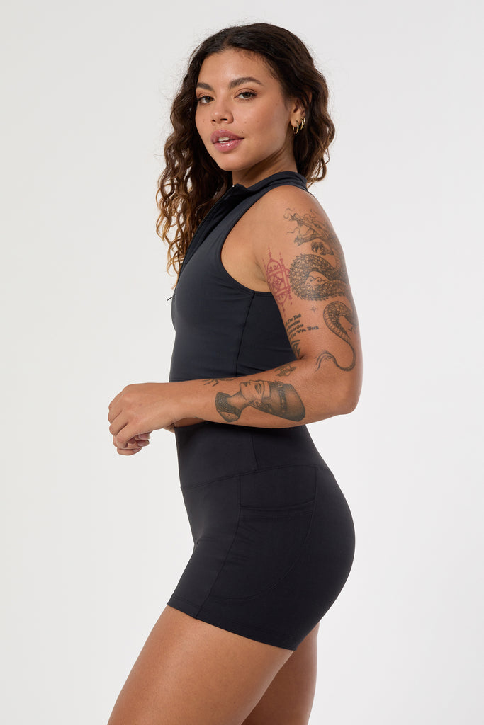 Cute black shorts: mid-high waisted with side pockets, V-shaped back seam, squat proof, no front seam, and double-layered waistband, side view