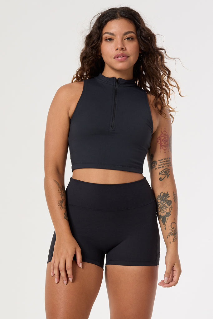 The perfect triple-layered black sports bra with removable cups and a front zip. Perfect for low-impact workouts, worn zipped or unzipped in and out of the gym