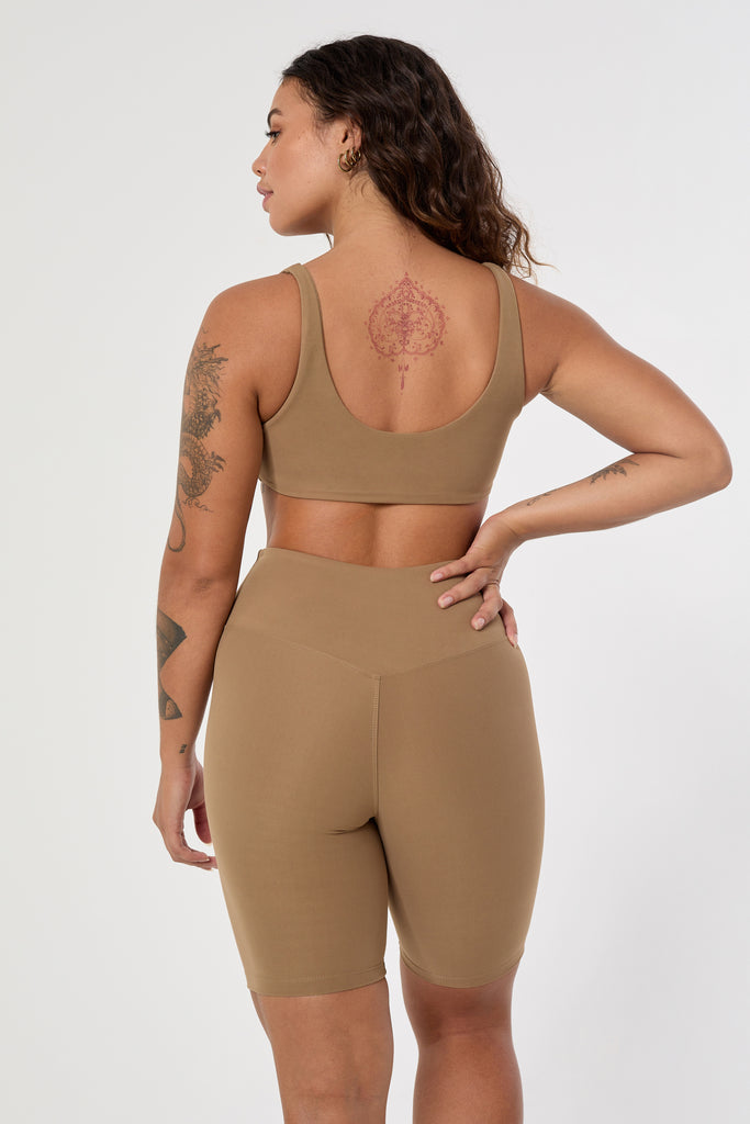 Mid-high waisted Light brown shorts with a V-shaped back seam for a flattering lift. Squat proof, no front seam, and double-layered waistband, back view