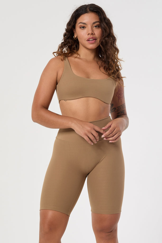 Mid-high waisted Light brown shorts with a V-shaped back seam for a flattering lift. Squat proof, no front seam, and double-layered waistband