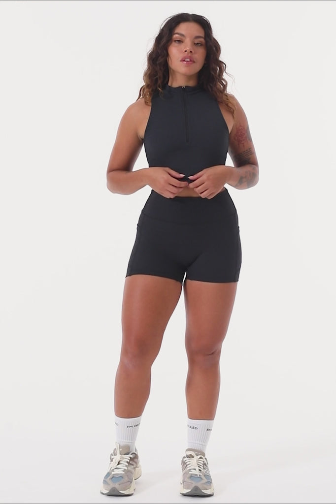 The perfect triple-layered black sports bra with removable cups and a front zip. Perfect for low-impact workouts, worn zipped or unzipped in and out of the gym