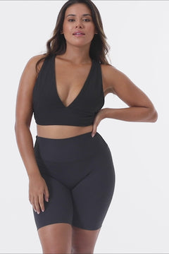 Black deep V-neck low-impact support with a seamless fit, removable padding for all-day comfort and style.