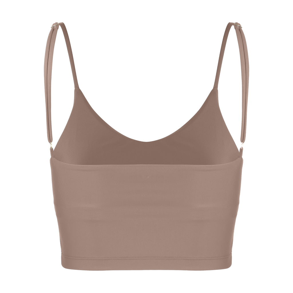 Sand coloured crop top with inbuilt bra for low-impact activities, seamless fit, removable padding, and adjustable straps. Comfortable for work or on the go, ghost image back view
