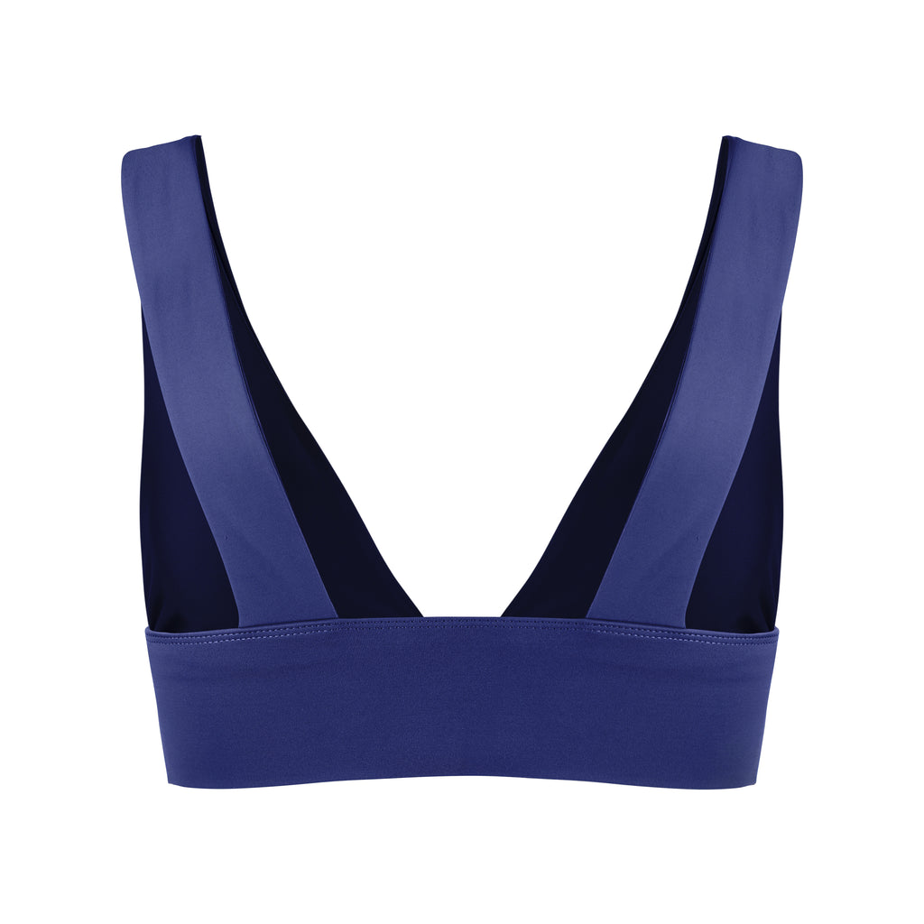 Classy and sexy sports bra in royal blue with low-impact support, seamless fit, removable padding, and a wide under-bust elastic band  ghost image back view