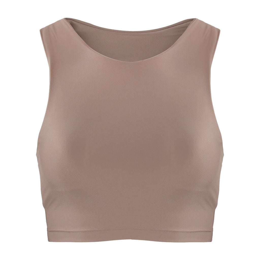 Award-winning sand coloured crop top with a flattering cut, high neckline for coverage, and in-built sports bra. Medium impact support, perfect for day wear, ghost image front view