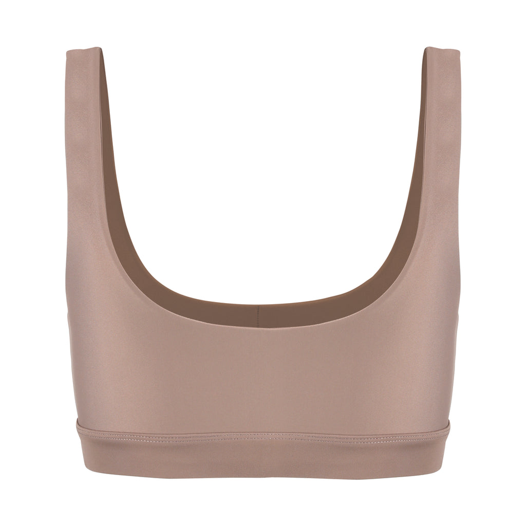Beige classic sports bra with mid to high impact support, seamless fit that holds everything in place, removable padding, ghost image back view