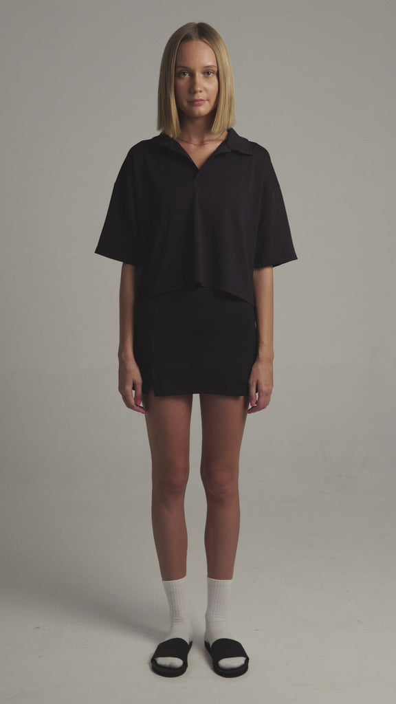 Black Boxy Polo Shirt with lightweight, airy sleeves for free movement 