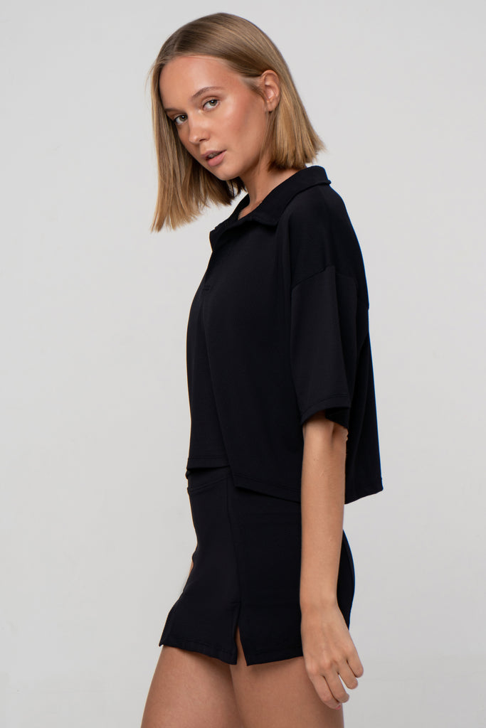 Black Boxy Polo Shirt with lightweight, airy sleeves for free movement, side view