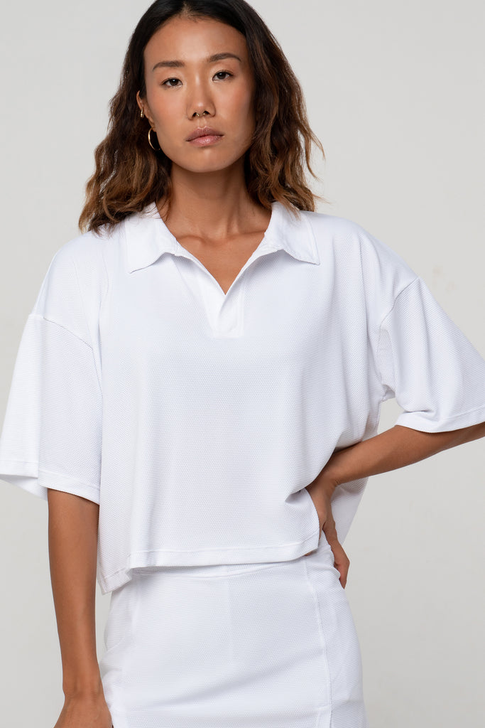 White Boxy Polo Shirt with lightweight, airy sleeves for free movement, front close up