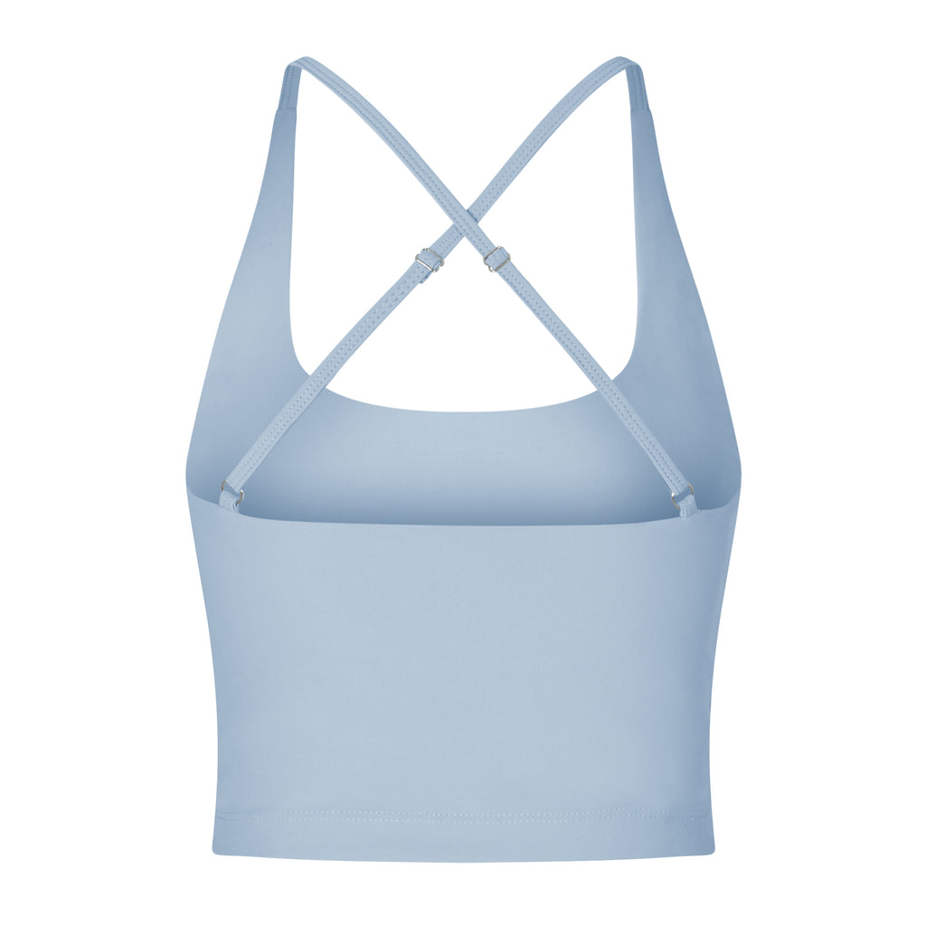 Light blue seamless crop top with cross back adjustable straps, in-built sports bra, and removable padding ghost image back view