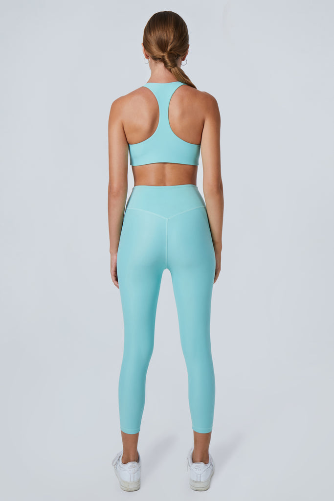 Super soft, high-waisted without a front seam for all-day comfort. Perfect for non abrasive sports and everyday wear, back view