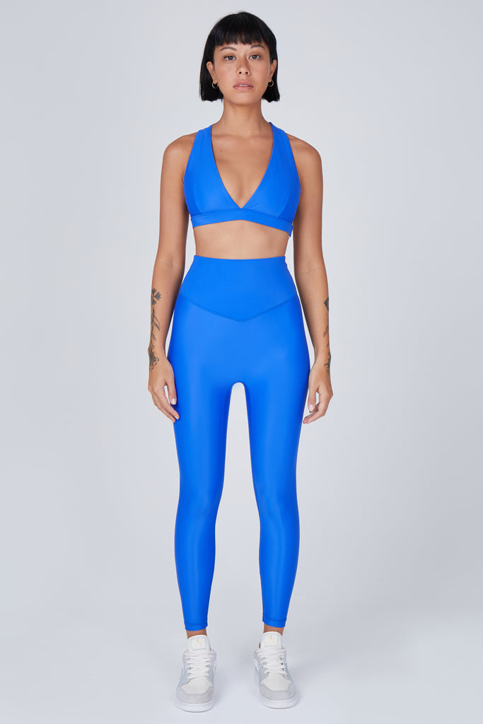 Versatile clear blue 7/8 compressive leggings that fit like a glove and stay put during workouts. Squat proof and no front seam for ultimate comfort, front view