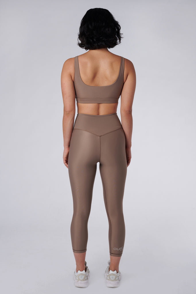 Versatile sand  colour 7/8 compressive leggings that fit like a glove and stay put during workouts. Squat proof and no front seam for ultimate comfort, back view