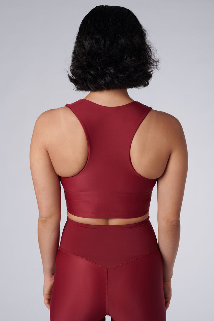 Award-winning wine red crop top with a flattering cut, high neckline for coverage, and in-built sports bra. Medium impact support, perfect for day wear, back view