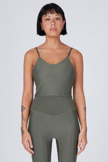 Olive green crop top with inbuilt bra for low-impact activities, seamless fit, removable padding, and adjustable straps. Comfortable for work or on the go, 